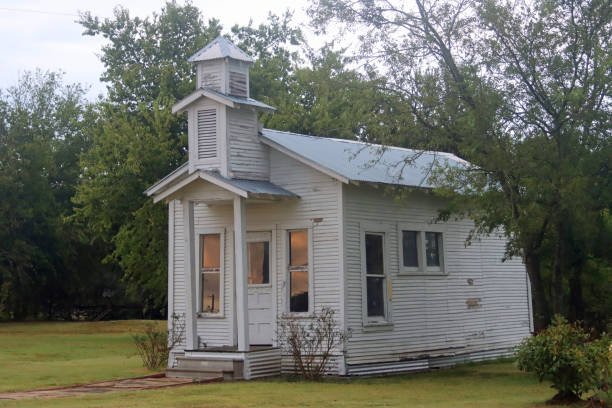 istock Old abandoned white wood small chapel 1272793218