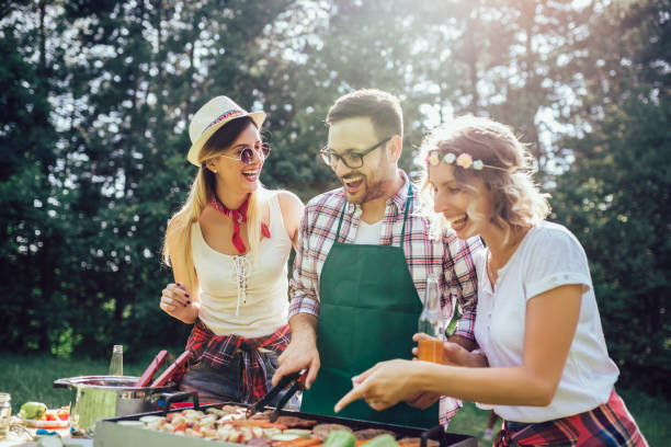 istock Friends having a barbecue party in nature 1272796773
