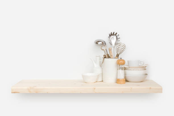 istock Various kitchen utensils on natural wooden shelf with copy space 1272797526