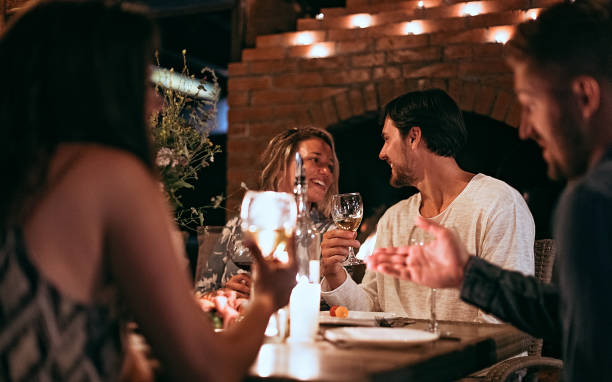 istock Group of friends having dinner party 1272797592