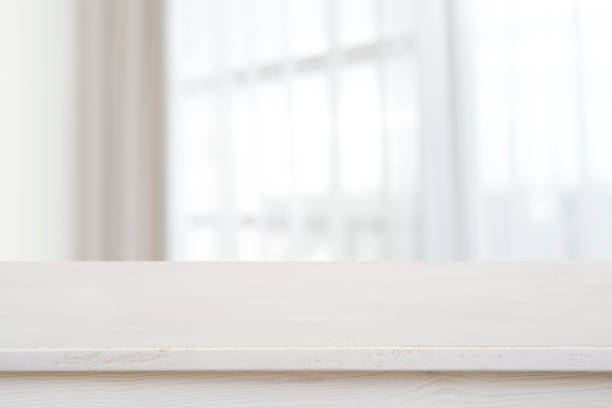 istock Table top for product display on blurred curtained window view 1272798218