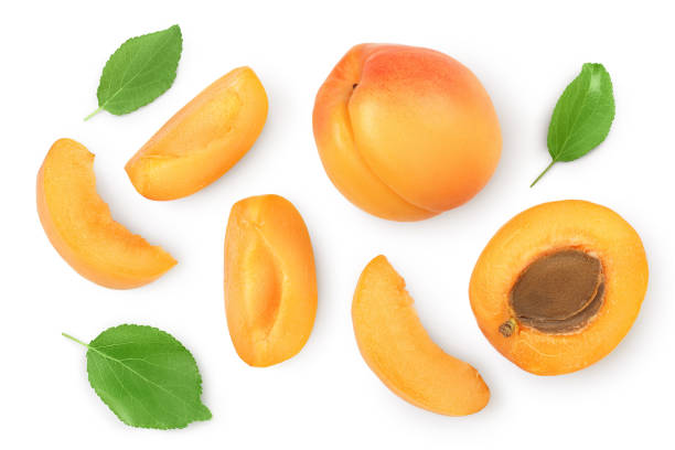 istock apricot fruit with half and slices isolated on white background. Clipping path. Top view. Flat lay 1272798463