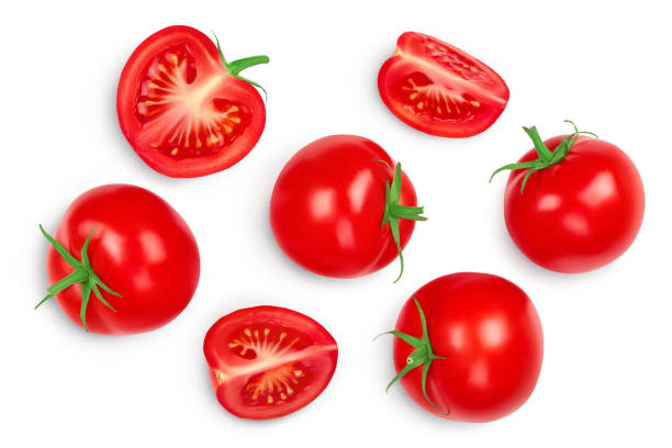 istock Tomato with half and slices isolated on white background. Clipping path and full depth of field. Top view. Flat lay 1272798501