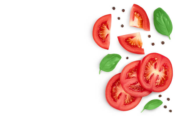 istock Tomato slices with basil and peppercorns isolated on white background. Clipping path. Top view with copy space for your text. Flat lay 1272798508