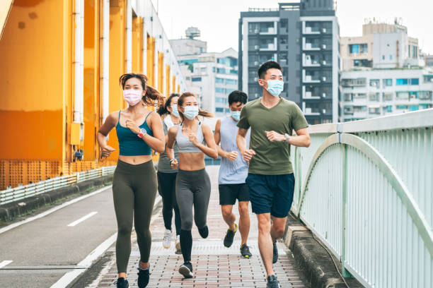 istock jogging wearing healthcare mask 1272798579