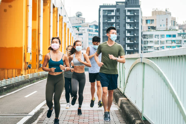 istock jogging wearing healthcare mask 1272798590