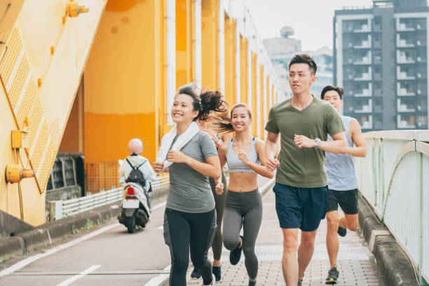 istock Friends jogging in the city 1272798623