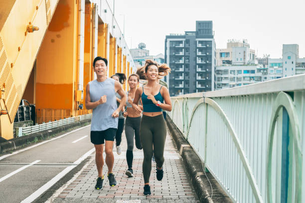 istock Friends jogging in the city 1272798635