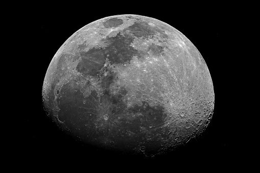 Moon shining on a black background