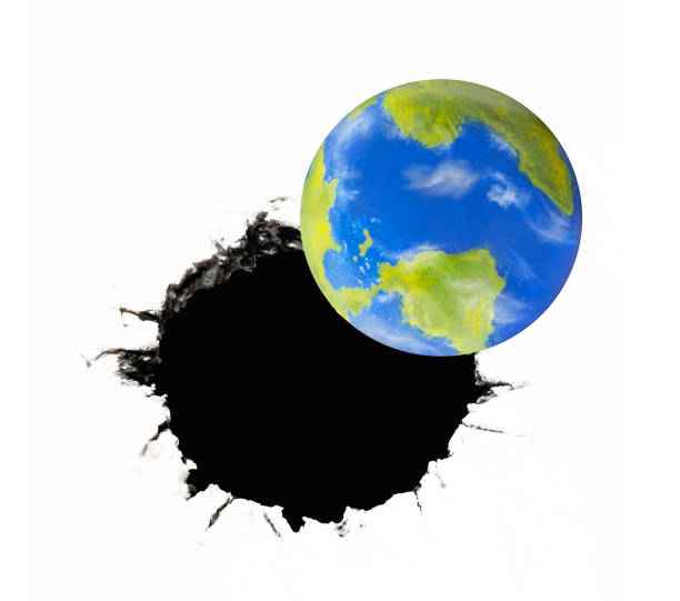 istock Planet earth near a black hole 1272798802