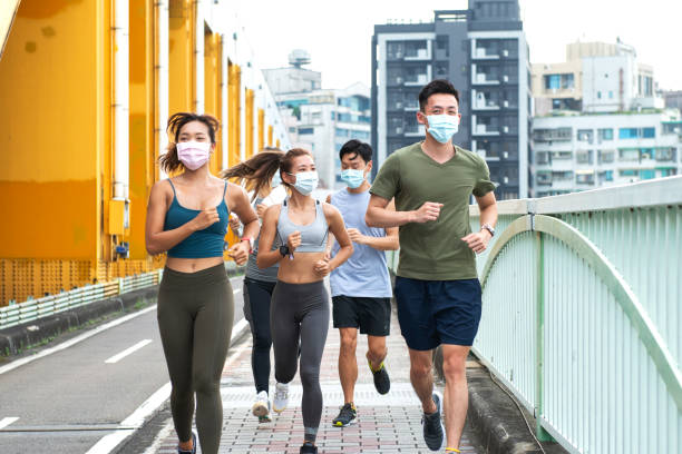 istock jogging wearing healthcare mask 1272798814
