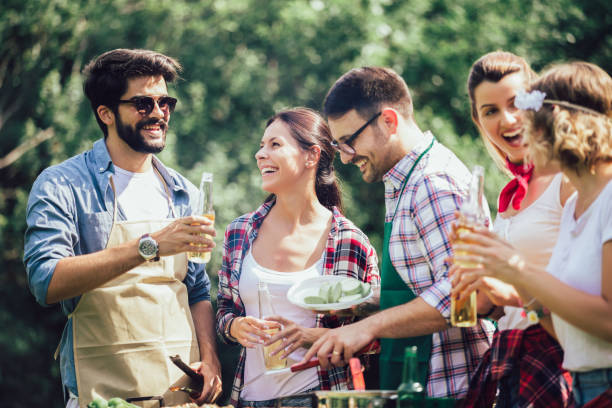 istock Friends having a barbecue party in nature 1272798872