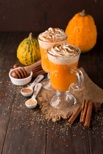istock Pumpkin spice latte with whipped cream on top on rustic wooden background 1272799686