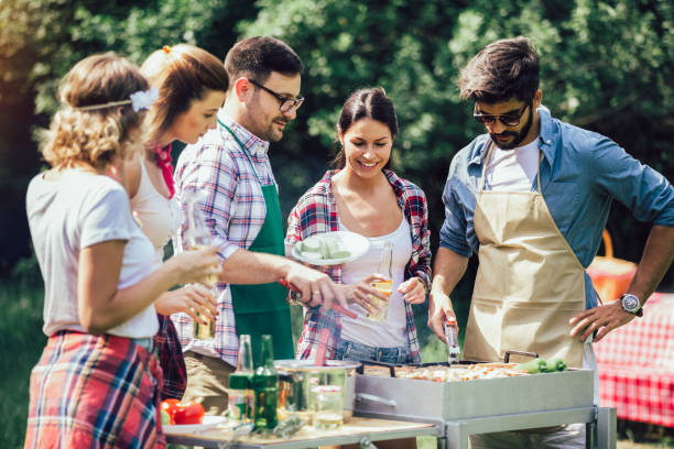 istock Friends having a barbecue party in nature 1272800240