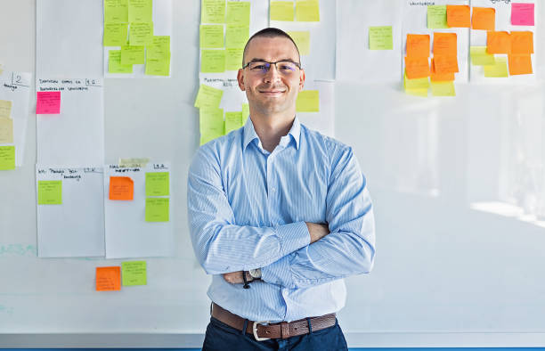 istock Businessman standing in the office 1272800286