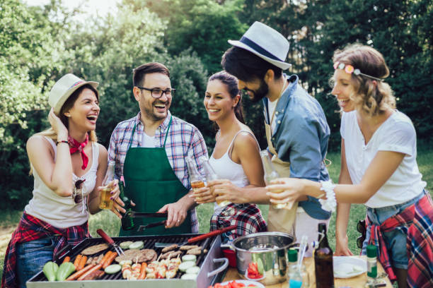 istock Friends having a barbecue party in nature 1272800361