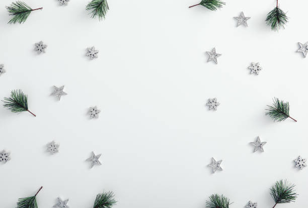 istock Ornament with pine branch, silver snowflake and star over white 1272800971