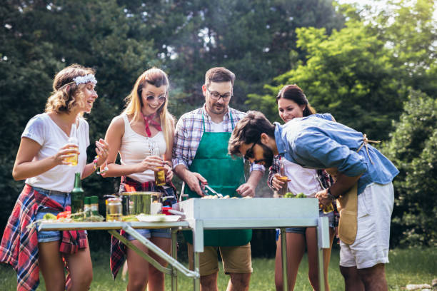 istock Friends having a barbecue party in nature 1272801734