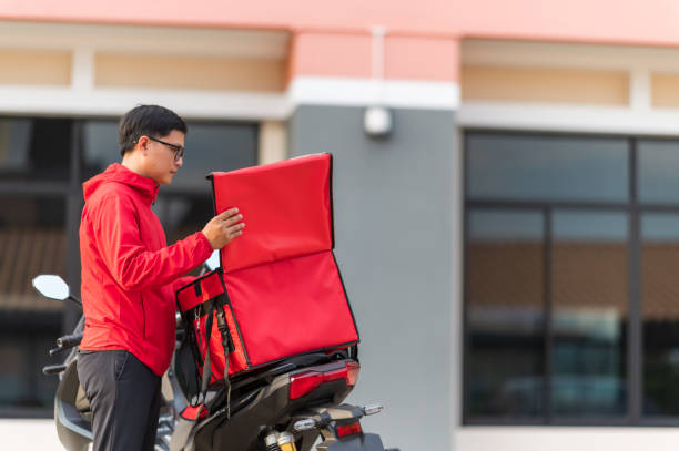 istock delivery man Prepare to deliver parcels to customers by motorbikes 1272802004