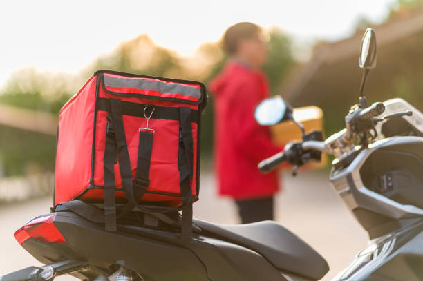 istock delivery man Prepare to deliver parcels to customers by motorbikes 1272802007