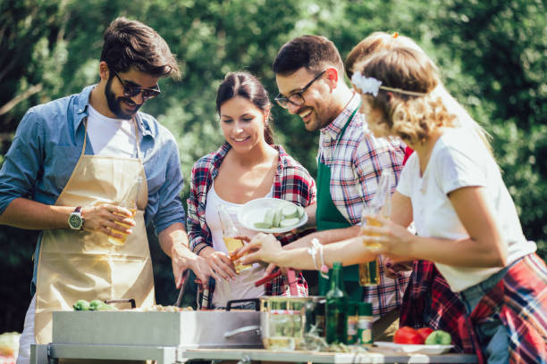 istock Friends having a barbecue party in nature 1272802162