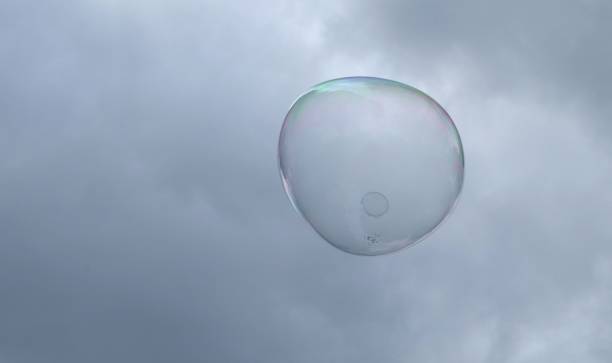 istock giant soap bubbles explode at the touch of children's hands 1272802349