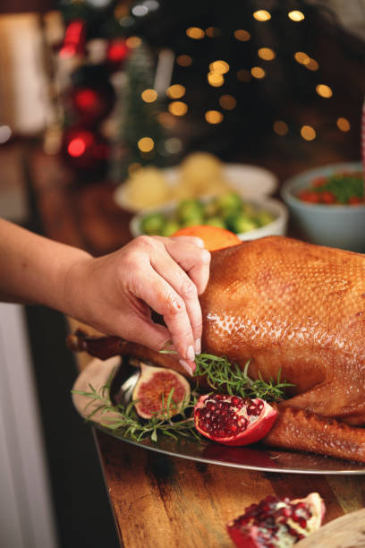 istock Preparing Stuffed Goose with Vegetables for Christmas Holidays 1272807055