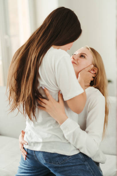 istock Two young women embracing 1272808436