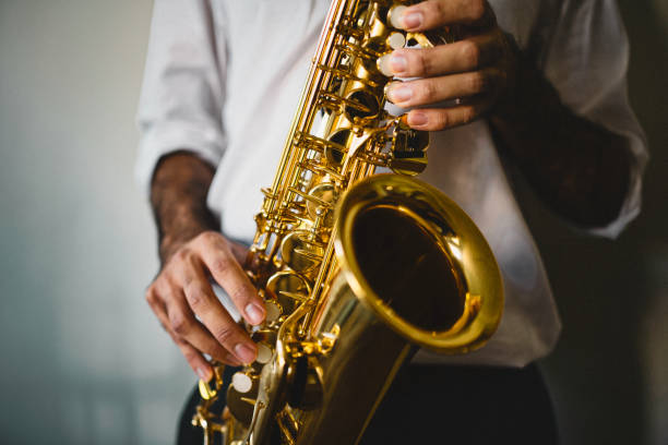 The saxophone player Saxophone, Player, vintage, dark, art, jazz, trumpet player, hand, luxury, close-up, sax arts and crafts stock pictures, royalty-free photos & images