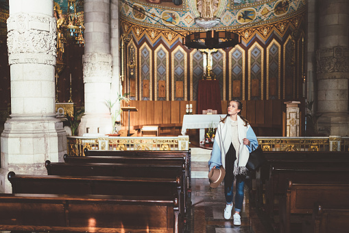 Tourist woman visiting the Church of the Sacred Heart of Jesus located at Mount Tibidabo,Barcelona