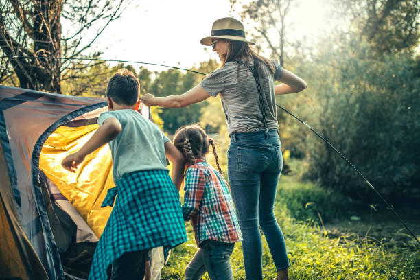 istock Parent and two children on camping trip 1272809848