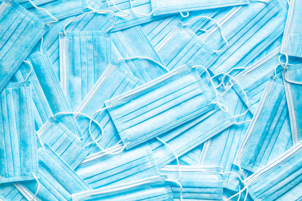 istock Blue paper face masks. Corona virus protection. 1272810990