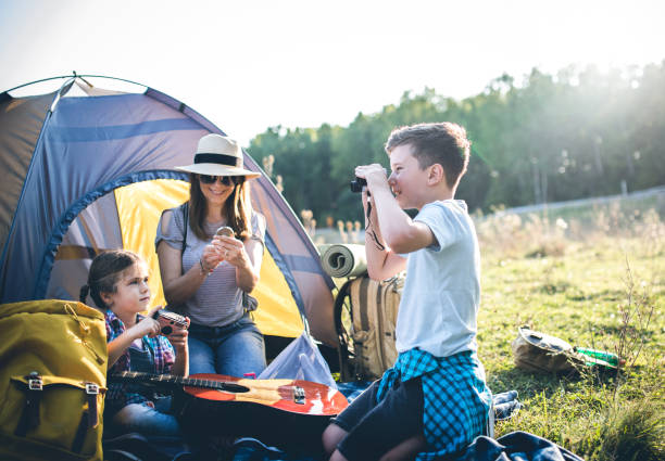 istock Parent and two children on camping trip 1272811261