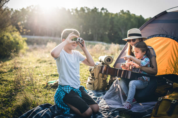 istock Parent and two children on camping trip 1272811331