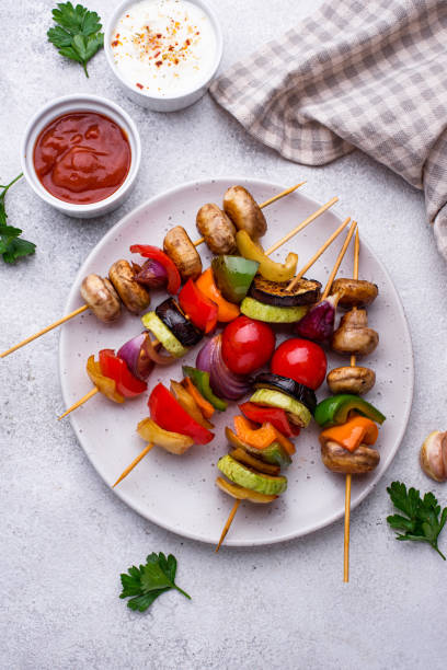 istock Vegetarian skewers with different grilled vegetables. 1272812565