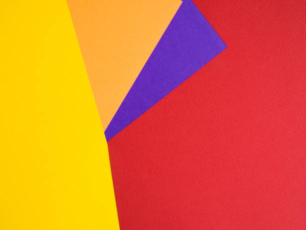 istock Multicolored paper background. yellow orange blue red abstract for summer background. 1272814393