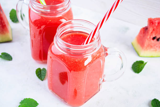 istock Fresh delicious watermelon smoothie with ice on white background 1272815048