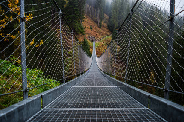 istock Suspended metal bridge. 1272815208