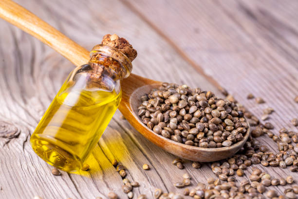 istock Hemp seeds and hemp seed oil on wooden background 1272817421