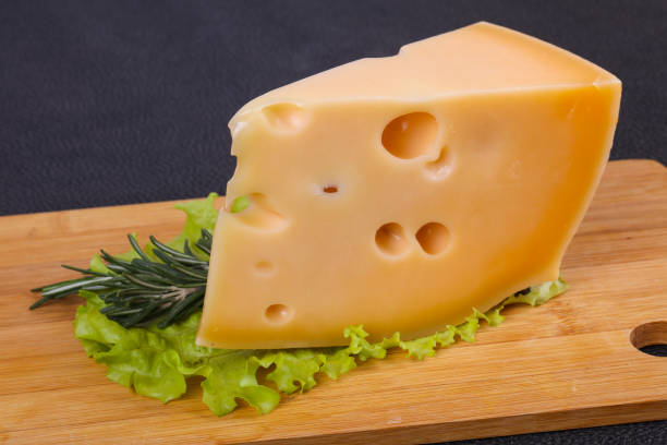 istock Maasdam cheese  in the board served salad leaves 1272817653