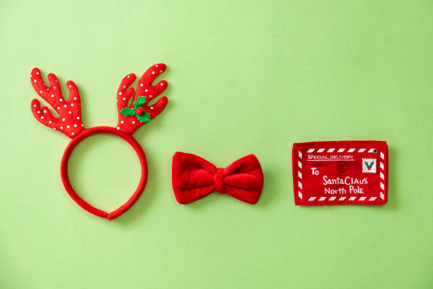 istock Collection of Christmas objects on green background viewed from above 1272819159