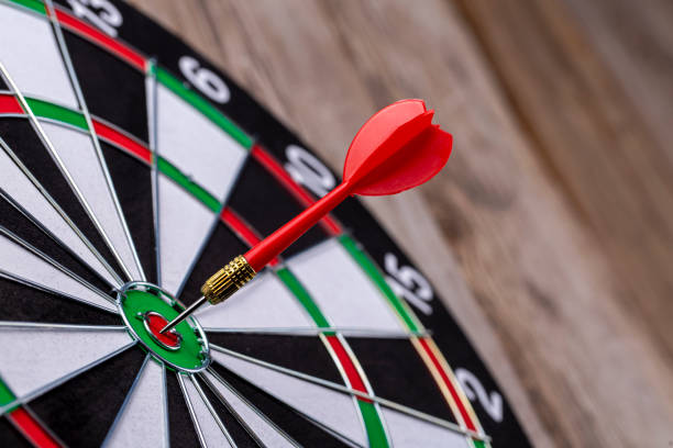 istock Dart board on the wooden background 1272819438