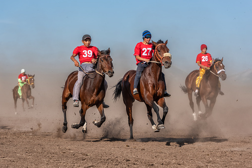 Kazakhstan, Shalkode, July 21, 2018.\nSeries Traditional horse racing at a rural festival. Baiga is one of the oldest and most popular types of horse racing among many Turkic peoples. Distances range from 5 to 50 kilometers. Riders are usually boys 10-15 years old. As a reward, the owner of the winning horse receives cars or cash prizes.