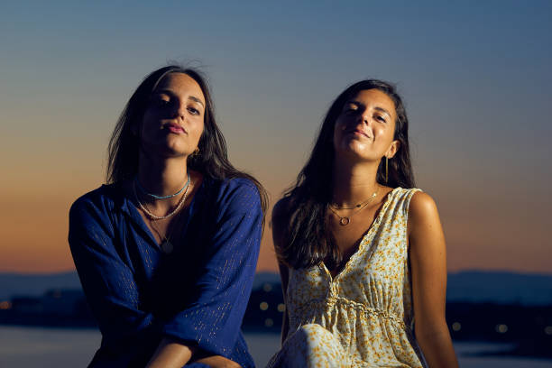 istock two young female friends looking intently 1272820237