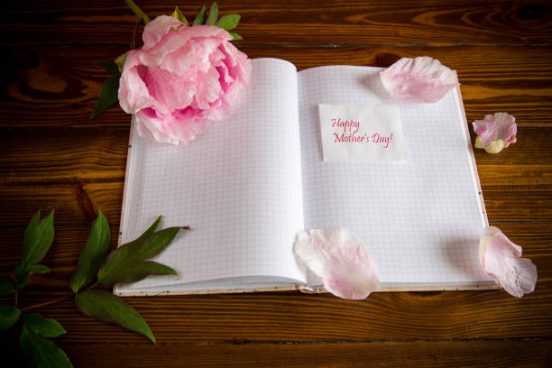 istock pink beautiful peony with petals, blank notebook and greeting card 1272820349