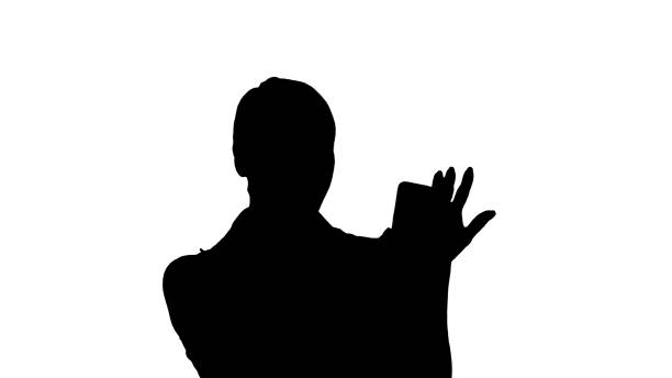 istock Silhouette Woman wearing pink making video call on the smart pho 1272820420