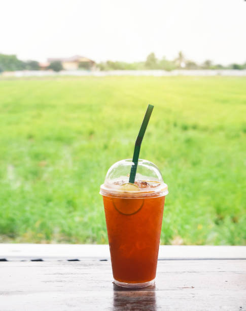 istock iced lemon tea on wooden table outdoor 1272820450