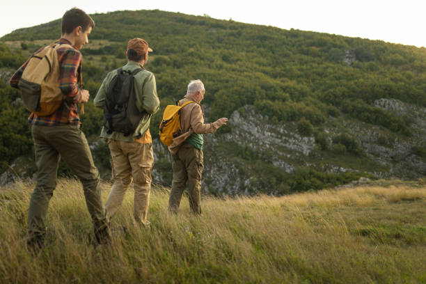 istock Three-generation family hiking together on mountain 1272822047