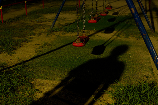 I stand up near the swing.