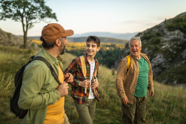 istock Three-generation family hiking together on mountain 1272822119